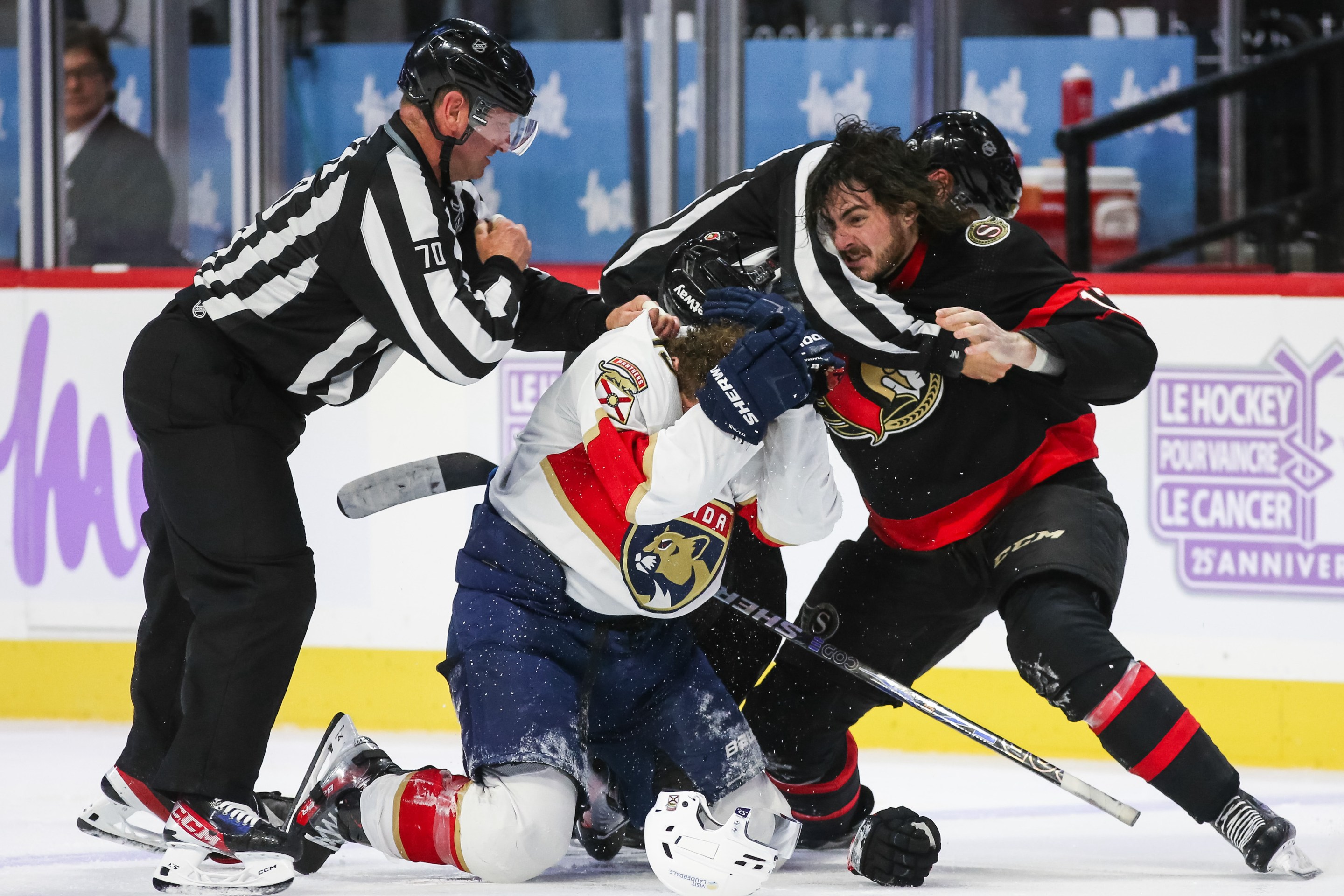 Matthew Tkachuk #19 of the Florida Panthers protects himself from Zack MacEwen #17 of the Ottawa Senators during the third period at Canadian Tire Centre on November 27, 2023.