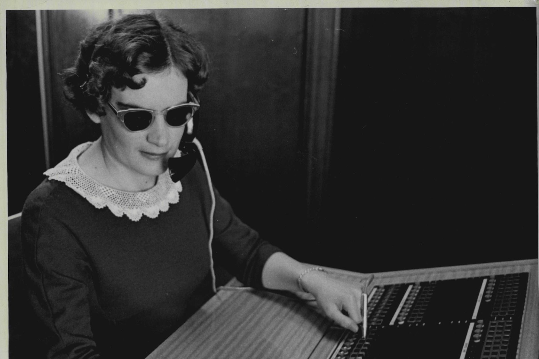 A woman operating a switchboard