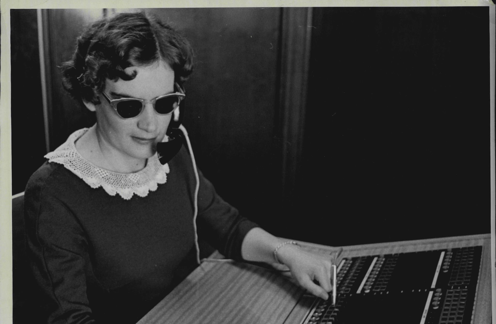 A woman operating a switchboard