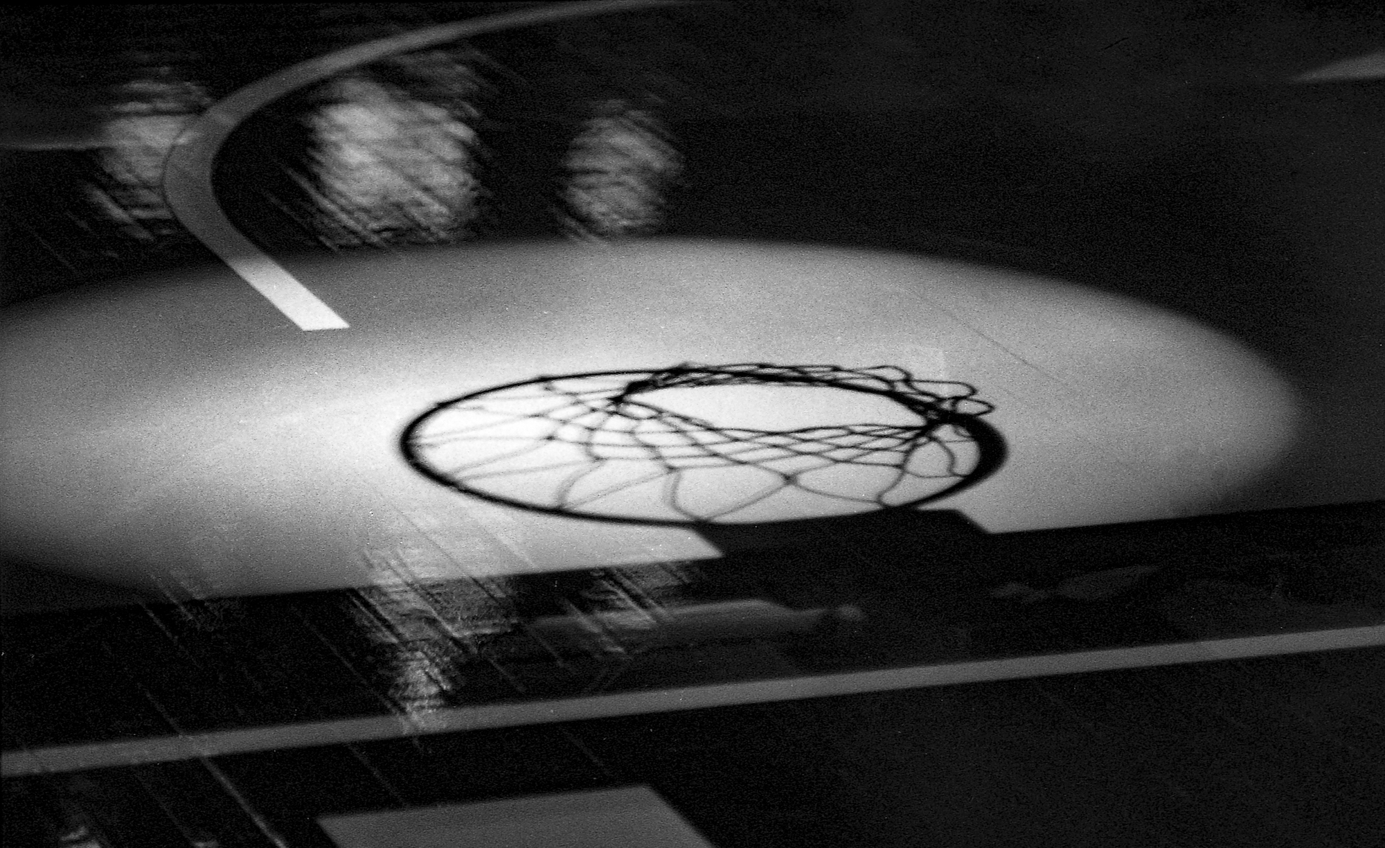 Black and white photo of a basketball court