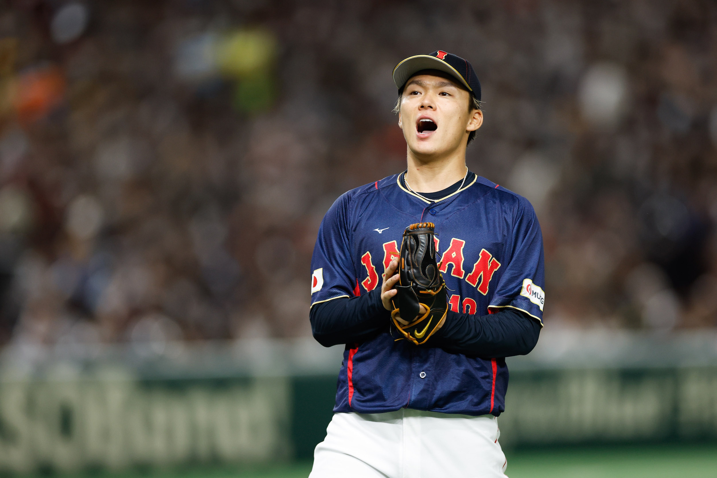 Yoshinobu Yamamoto #18 of Team Japan reacts while pitching during Game 8 of Pool B between Team Japan and Team Australia at Tokyo Dome on Sunday, March 12, 2023 in Bunkyo City, Japan.