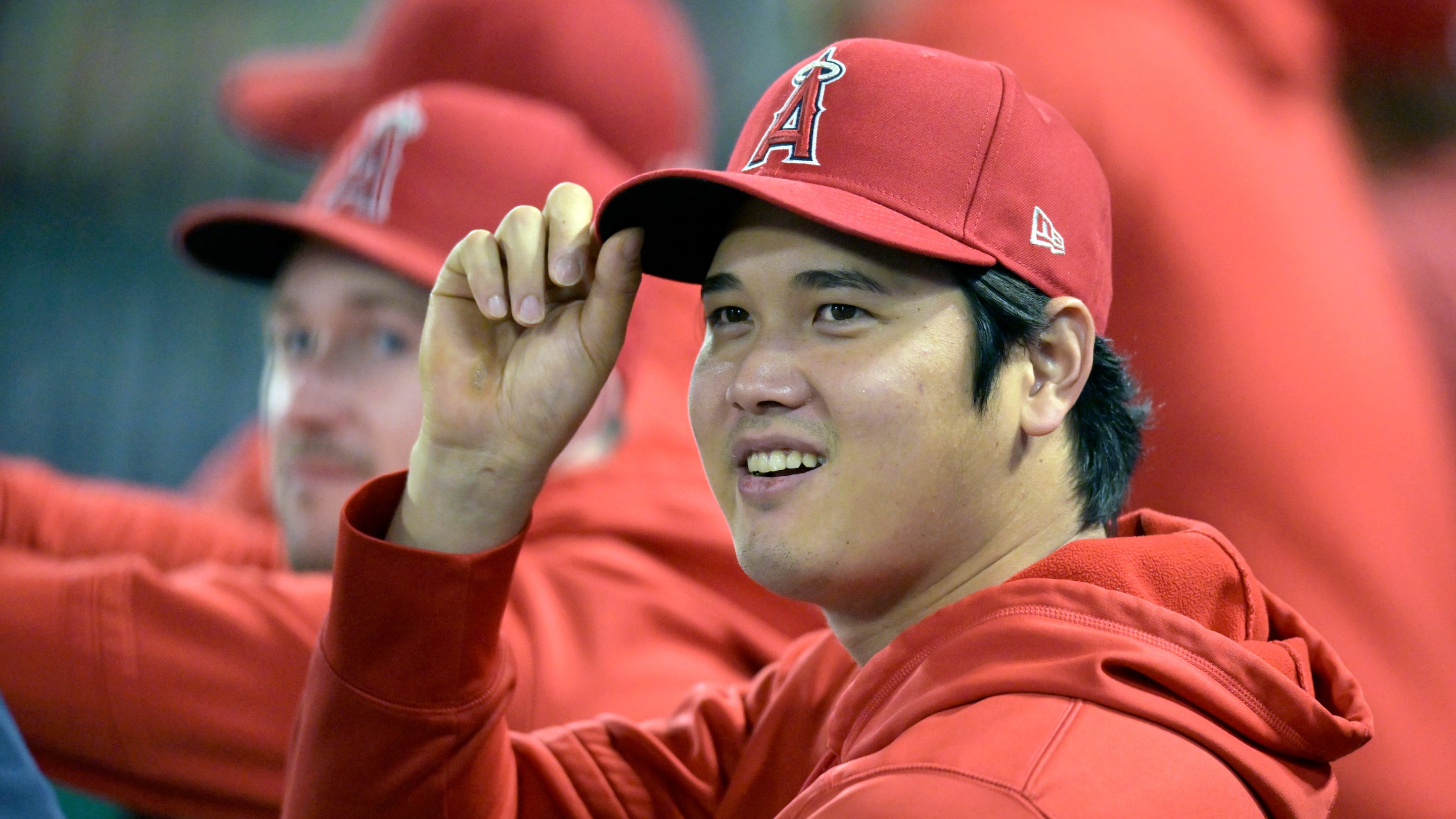 Shohei Ohtani sits on the bench during a September Angels game in 2023.