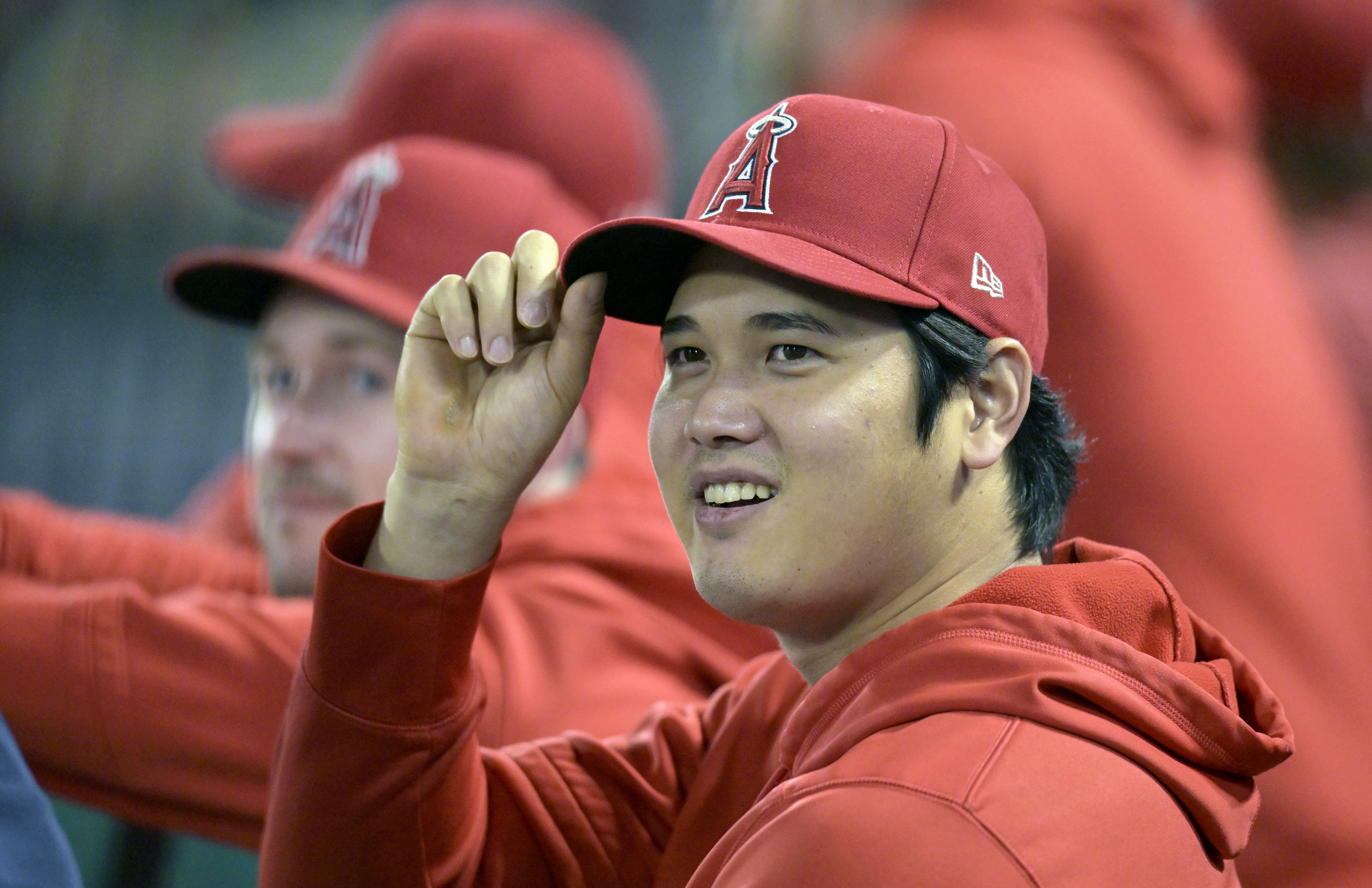 Shohei Ohtani sits on the bench during a September Angels game in 2023.
