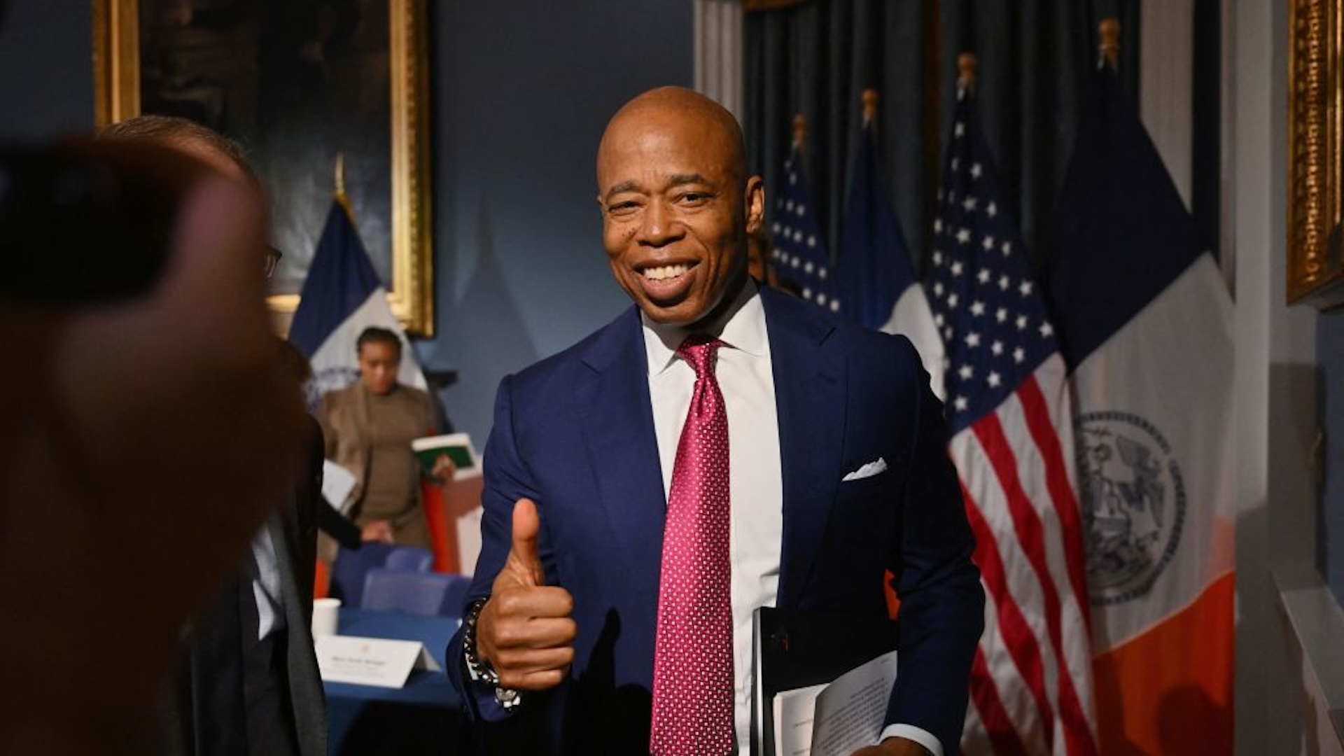 New York Mayor Eric Adams gives a thumbs up as he leaves his weekly press conference at New York City Hall on November 14, 2023. FBI agents seized the New York mayor's cell phones and other devices, his campaign lawyer said 10 November, 2023, in an apparent escalation of a federal investigation into campaign fundraising. The seizure appears to be part of a corruption investigation into whether Eric Adams' 2021 campaign conspired with Turkey's government and others.