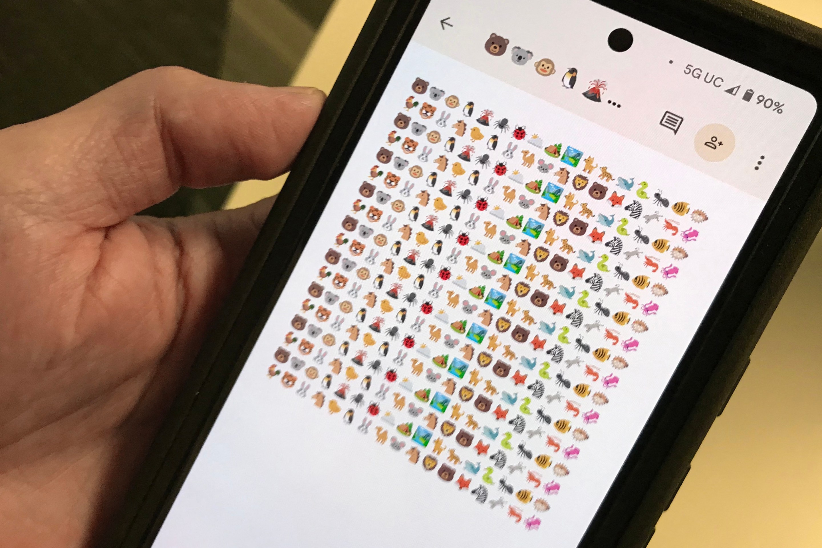 This photo illustration created on December 11, 2023 shows emojis on a smartphone screen in Washington, DC. Too many cats, not enough crustaceans: The current emoji catalog doesn't accurately represent the breadth of biodiversity seen in nature -- and that hurts conservation efforts, according to scientists. An analysis published on December 11, 2023 in the journal iScience found that while animals are well represented by the current emoji catalog, plants, fungi, and microorganisms get short shrift. (Photo by)