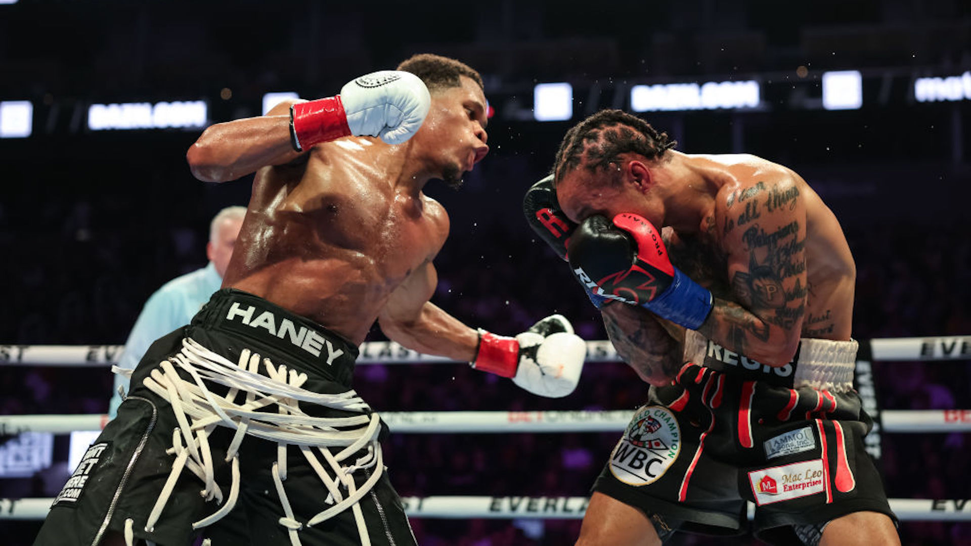 Devin Haney punches Regis Prograis during their WBC World Super Lightweight Title fight at Chase Center on December 09, 2023 in San Francisco, California.