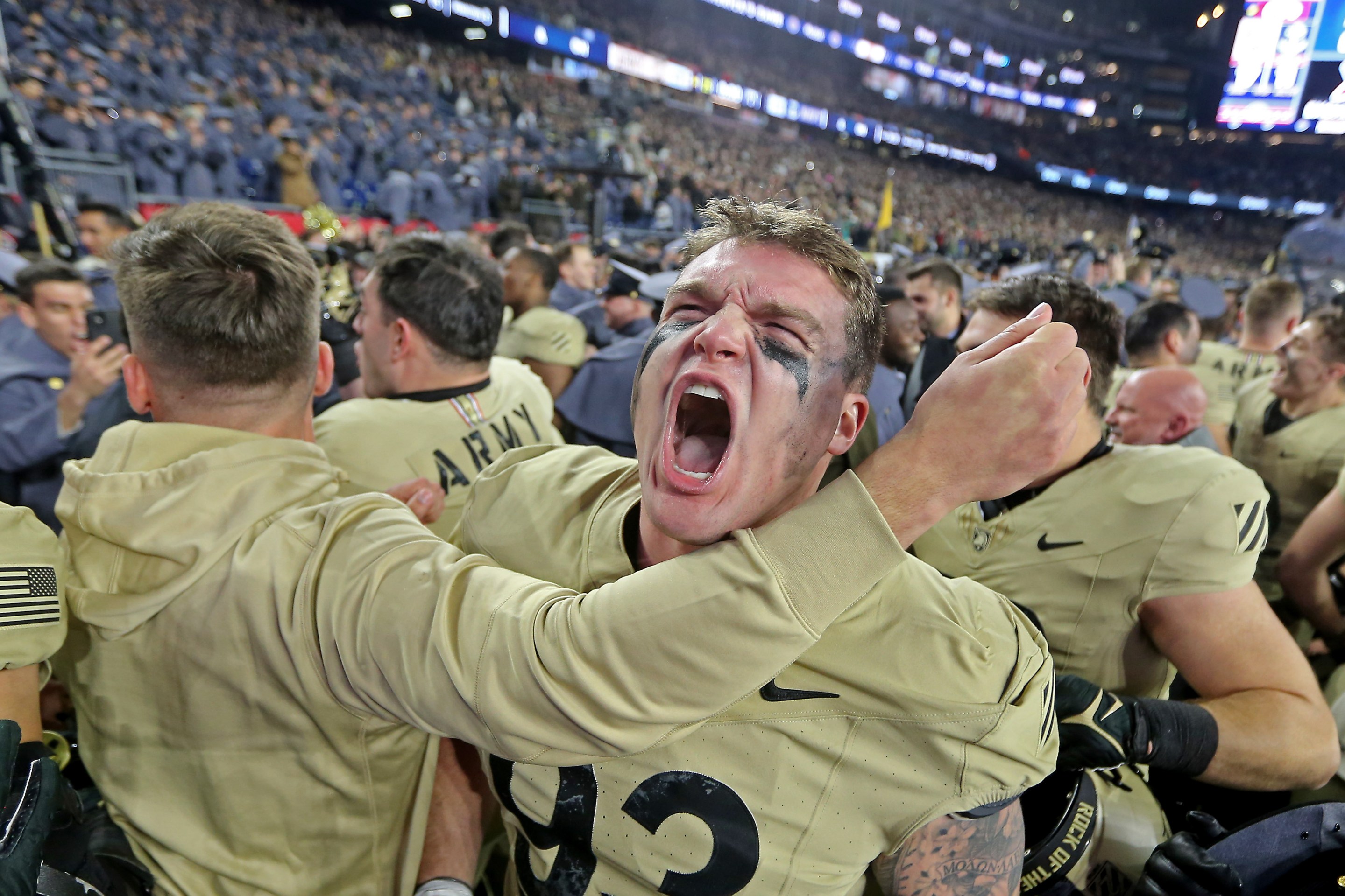 Army Black Knights defensive lineman Cody Winokur (93) screams after the win as Army takes on Navy at Gillette on December 9.