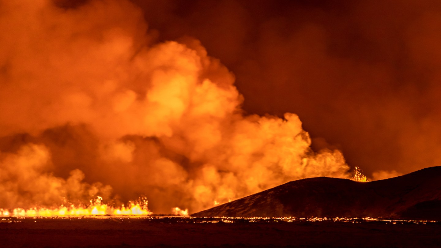 A volcano spews lava and smoke as it erupts in Grindavik, Iceland, December 18, 2023. (Photo by Snorri Thor/NurPhoto via Getty Images)