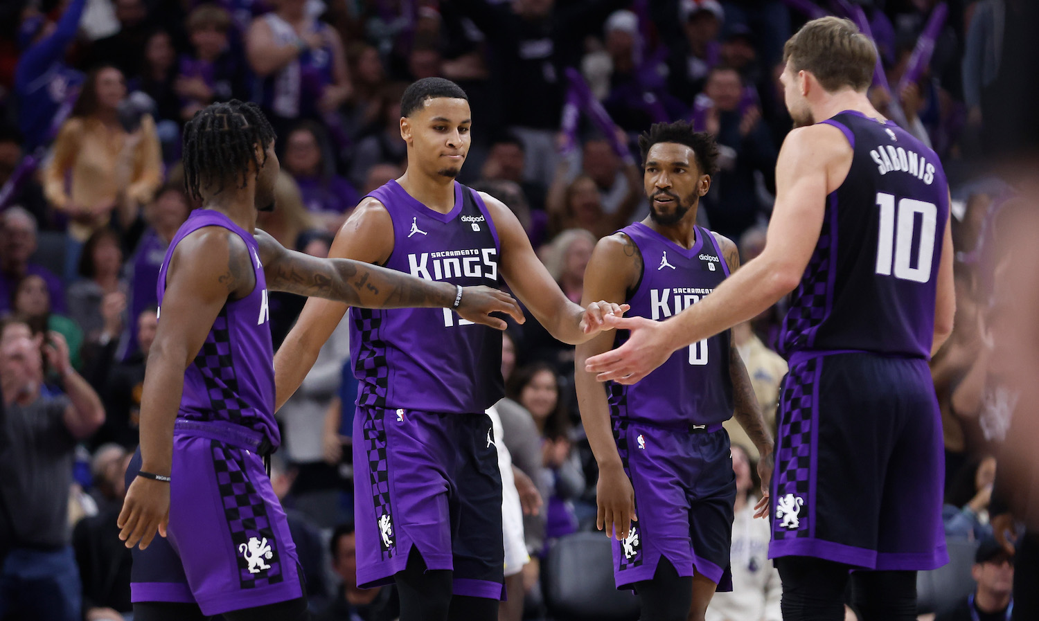 SACRAMENTO, CALIFORNIA - DECEMBER 16: Keegan Murray #13 of the Sacramento Kings (2nd L) reacts with teammates after making a three-point basket in the third quarter U at Golden 1 Center on December 16, 2023 in Sacramento, California. NOTE TO USER: User expressly acknowledges and agrees that, by downloading and or using this photograph, User is consenting to the terms and conditions of the Getty Images License Agreement. (Photo by Lachlan Cunningham/Getty Images)