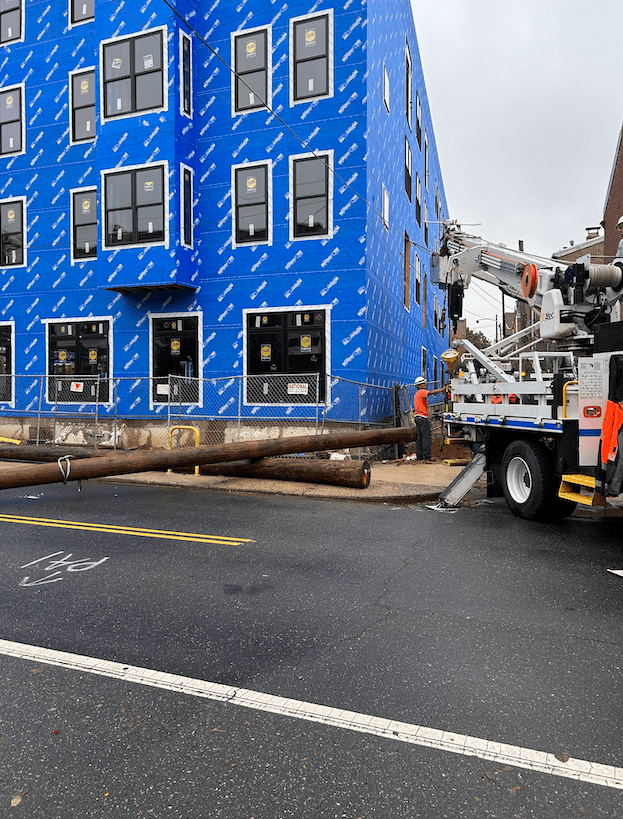 a electric truck stationed next to the wire