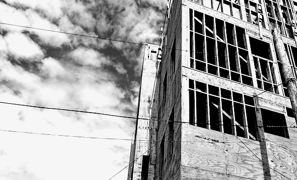 black and white photo of a building under construction