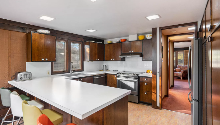 kitchen with dark cabinets with white pulls