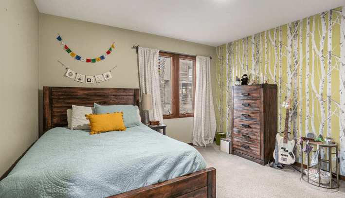 bedroom with tree wallpaper