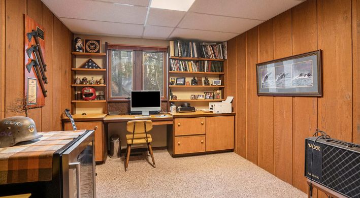 study with large wood panelling and built ins