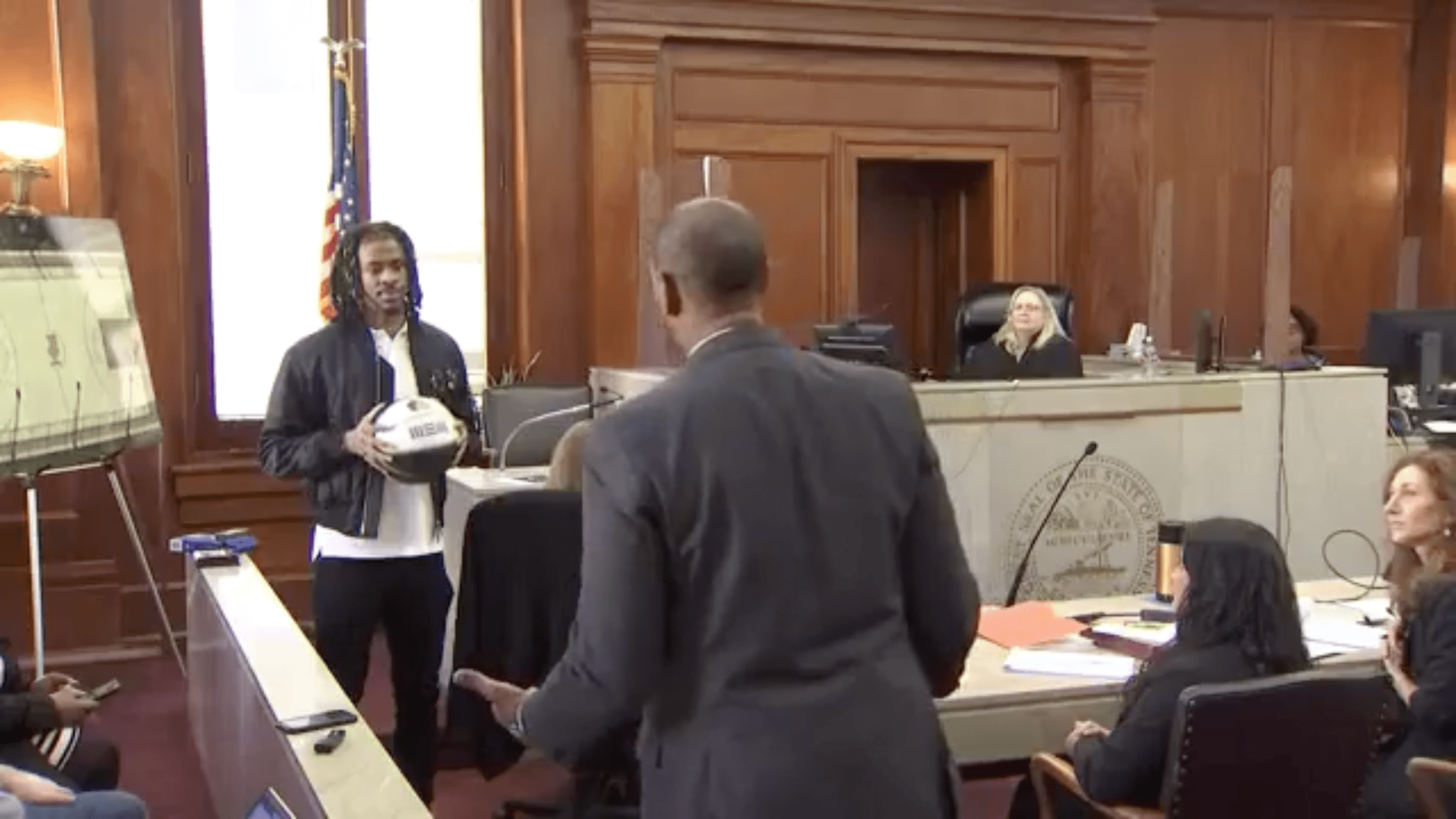 Ja Morant demonstrates check ball situation for his attorney.