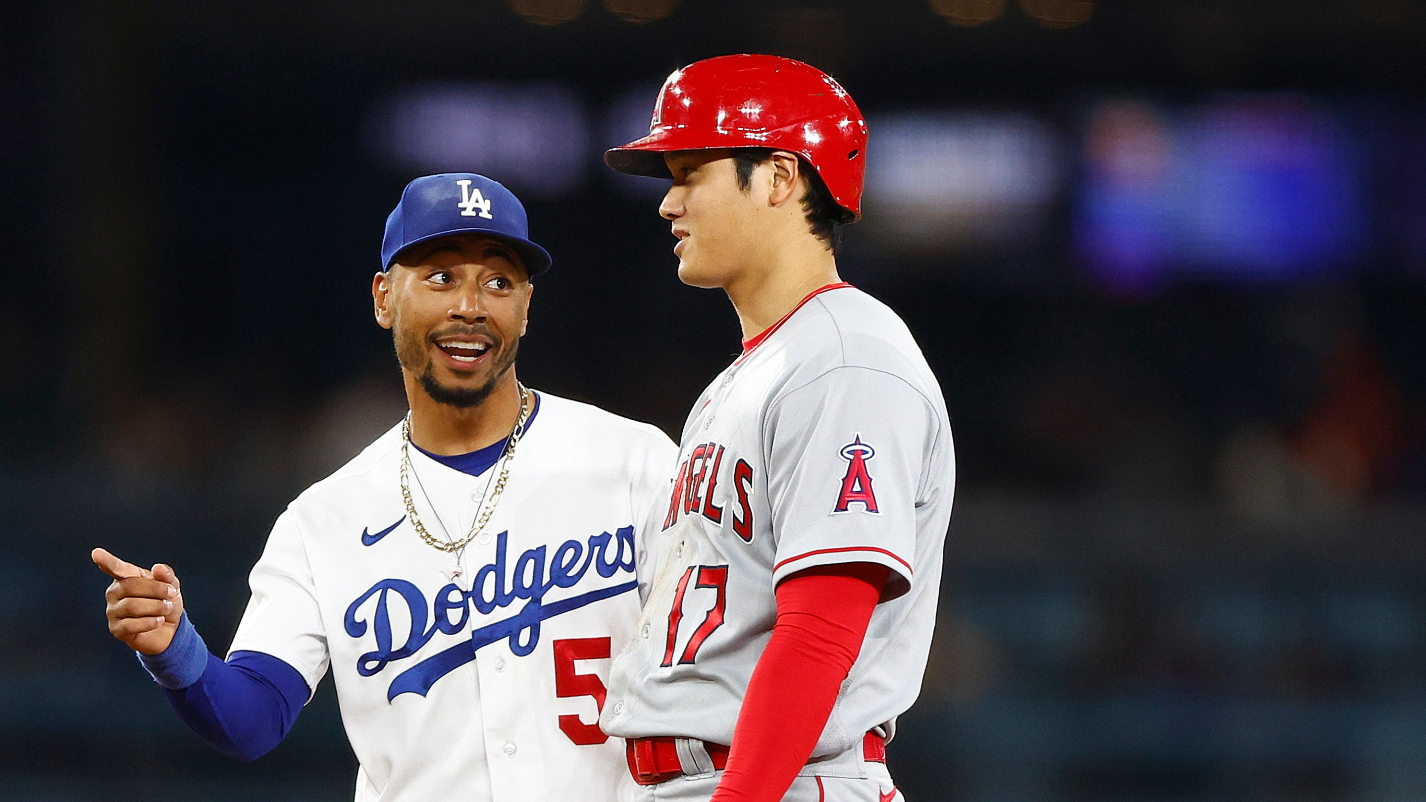 Mookie Betts #50 of the Los Angeles Dodgers and Shohei Ohtani #17 of the Los Angeles Angels in the fourth inning at Dodger Stadium on July 07, 2023 in Los Angeles, California.