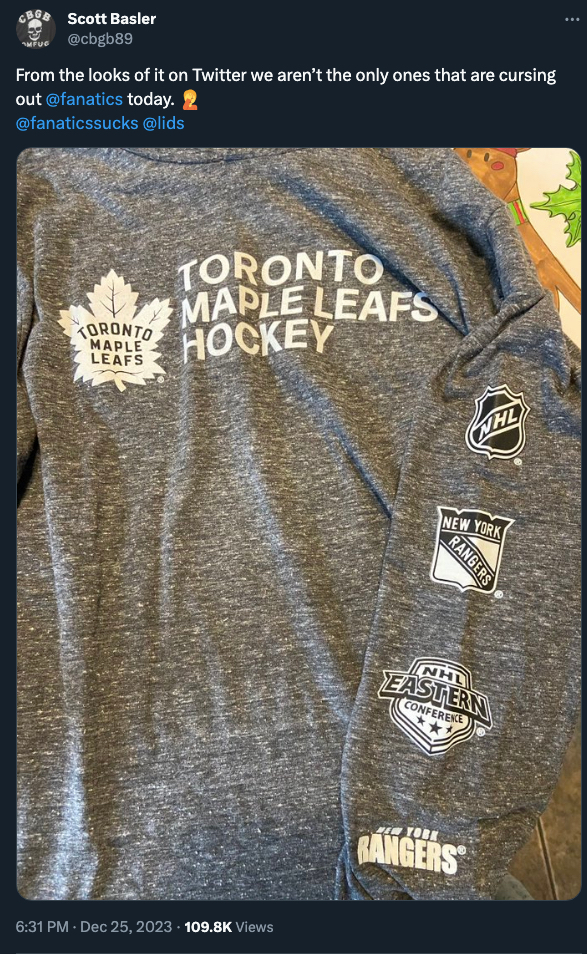 A Maple Leafs shirt that has a Rangers logo and wordmark.
