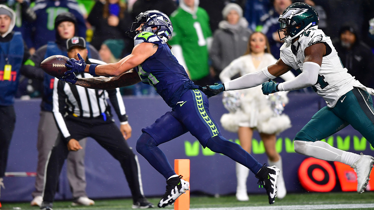 SEATTLE, WASHINGTON - DECEMBER 18: Jaxon Smith-Njigba #11 of the Seattle Seahawks catches a pass for a touchdown passed James Bradberry #24 of the Philadelphia Eagles in the fourth quarter at Lumen Field on December 18, 2023 in Seattle, Washington.