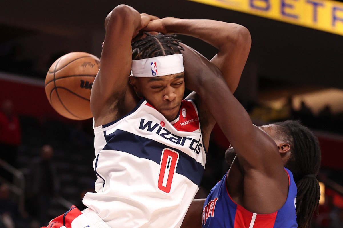 Bilal Coulibaly #0 of the Washington Wizards battles for control of the ball against Isaiah Stewart #28 of the Detroit Pistons during the second half at Little Caesars Arena on November 27, 2023 in Detroit, Michigan. Washington won the game 126-107.