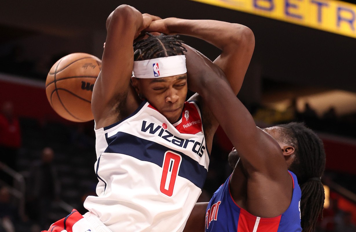 Bilal Coulibaly #0 of the Washington Wizards battles for control of the ball against Isaiah Stewart #28 of the Detroit Pistons during the second half at Little Caesars Arena on November 27, 2023 in Detroit, Michigan. Washington won the game 126-107.