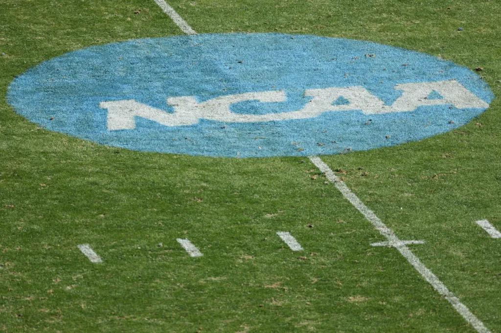 A NCAA logo is seen on the field before the game between the South Dakota State Jackrabbits and the North Dakota State Bison in the Division I FCS Football Championship held at Toyota Stadium on January 8, 2023 in Frisco, Texas.