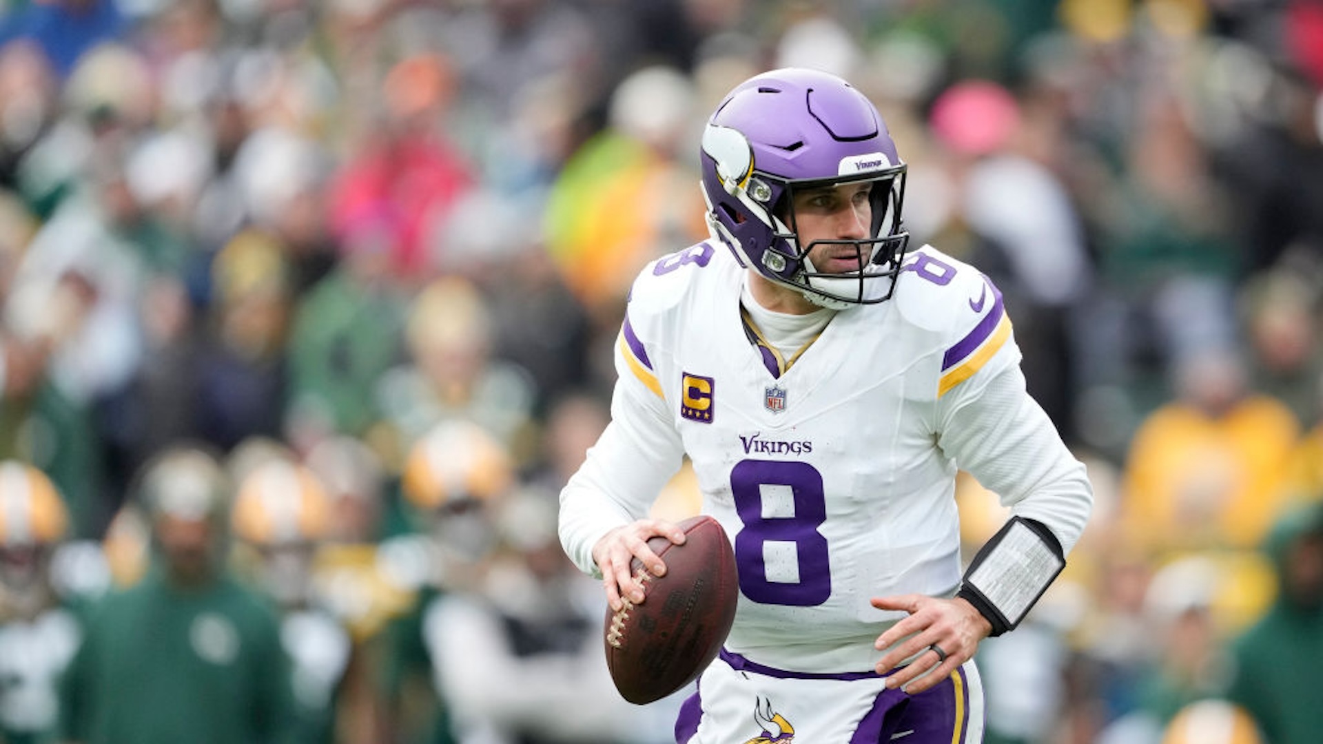 Kirk Cousins #8 of the Minnesota Vikings looks to throw a pass against the Green Bay Packers in the second half at Lambeau Field on October 29, 2023 in Green Bay, Wisconsin.