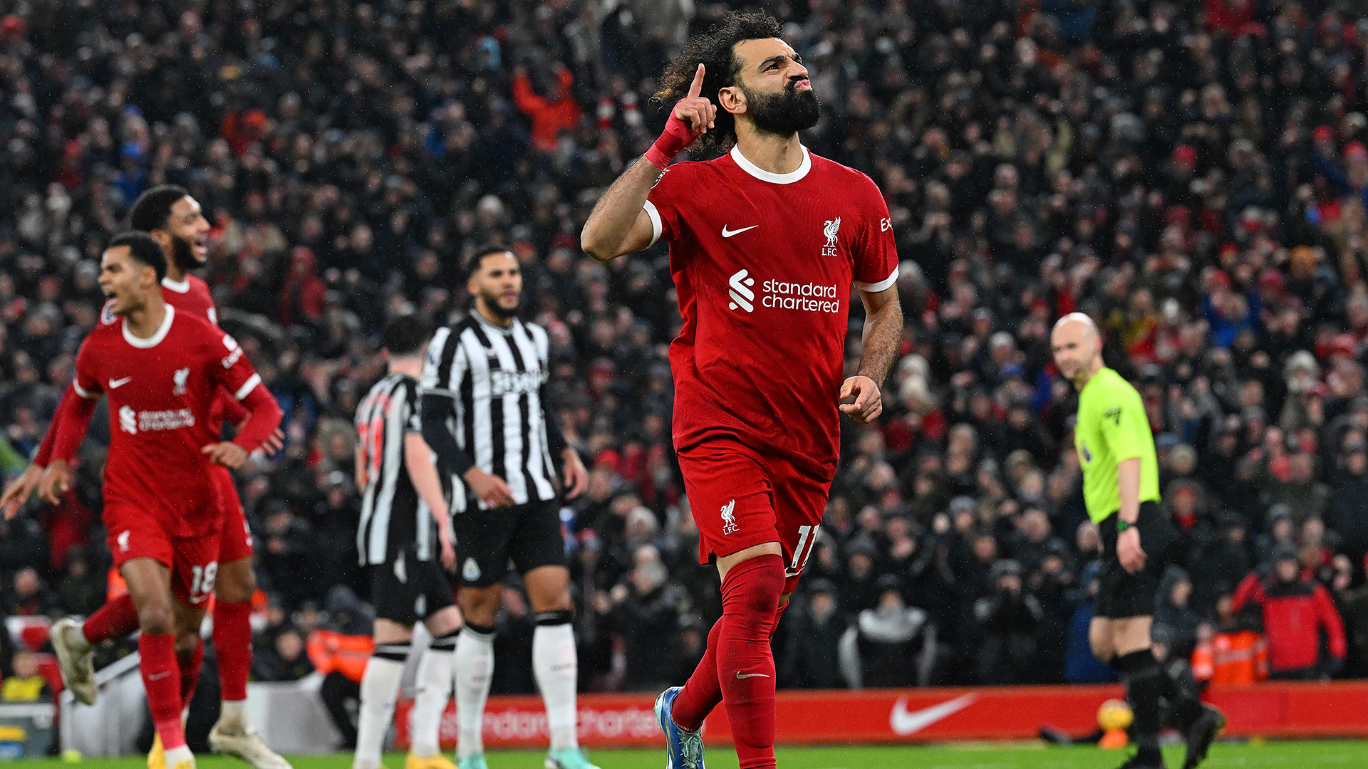 Mohamed Salah of Liverpool celebrates after scoring the fourth Liverpool goal during the Premier League match between Liverpool FC and Newcastle United at Anfield on January 01, 2024 in Liverpool, England.