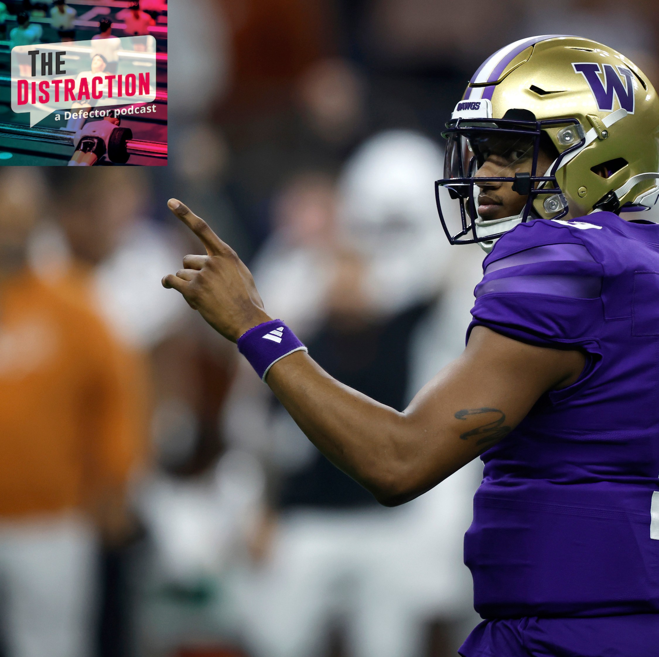 Michael Penix Jr, seen here pointing at The Distraction logo at upper left during Washington's win over Texas in the Sugar Bowl on 1/1/2024.
