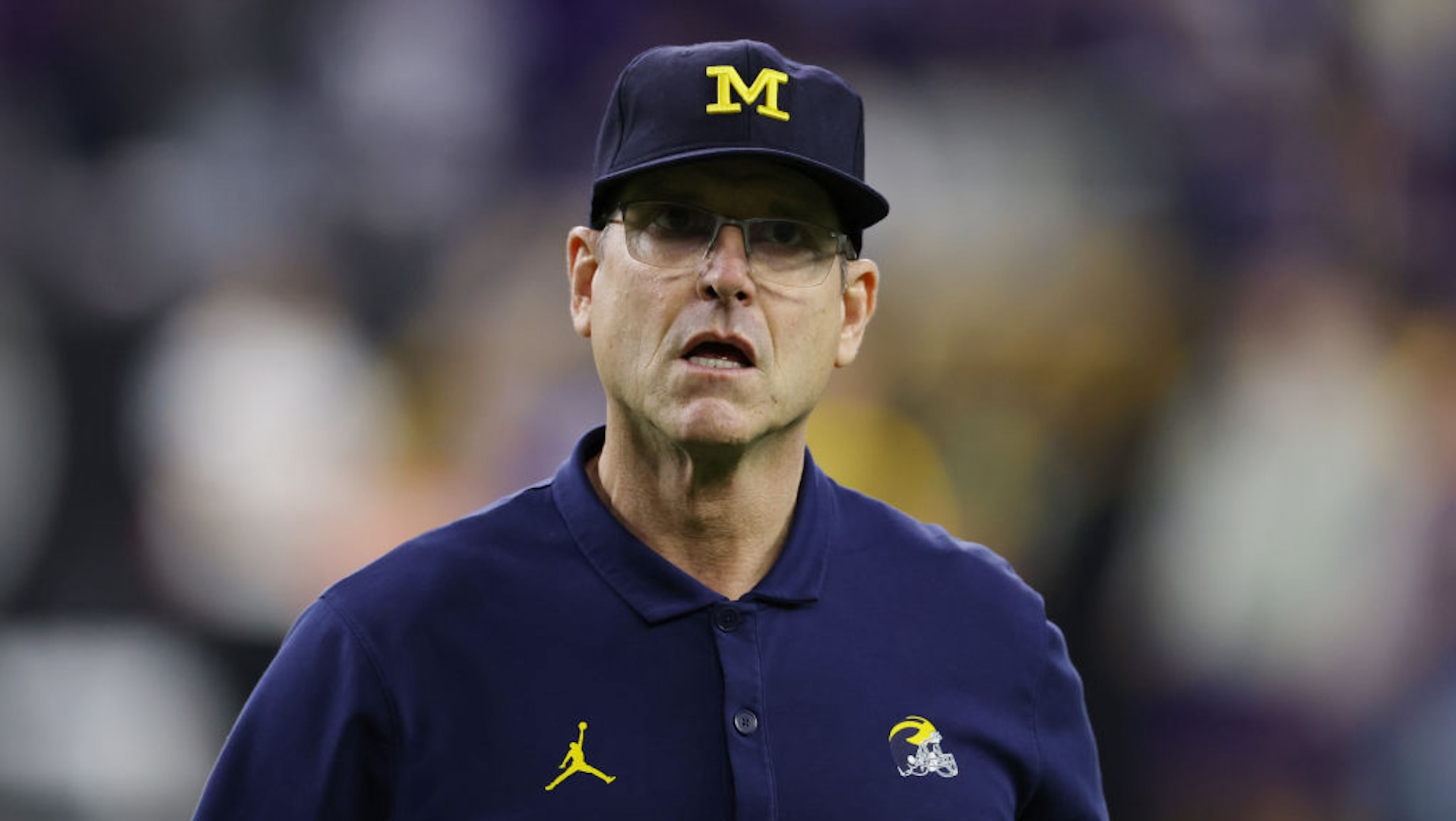 Head coach Jim Harbaugh of the Michigan Wolverines reacts during warm-ups prior to the 2024 CFP National Championship game against the Washington Huskies at NRG Stadium on January 08, 2024 in Houston, Texas.