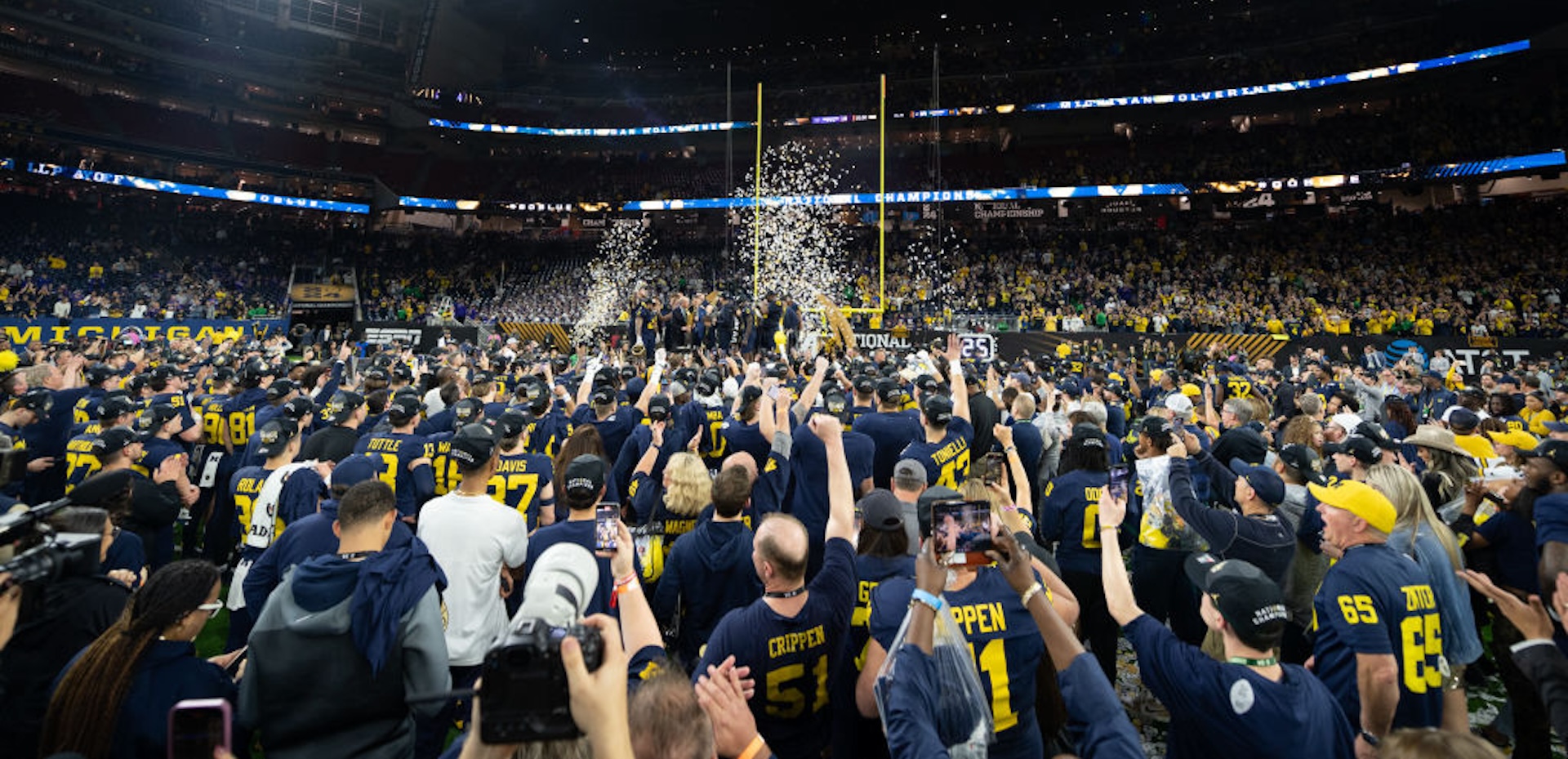 The Michigan Wolverines celebrate after winning the 2024 CFP National Championship game against the Washington Huskies at NRG Stadium on January 08, 2024 in Houston, Texas. The Michigan Wolverines won the game 34-13.