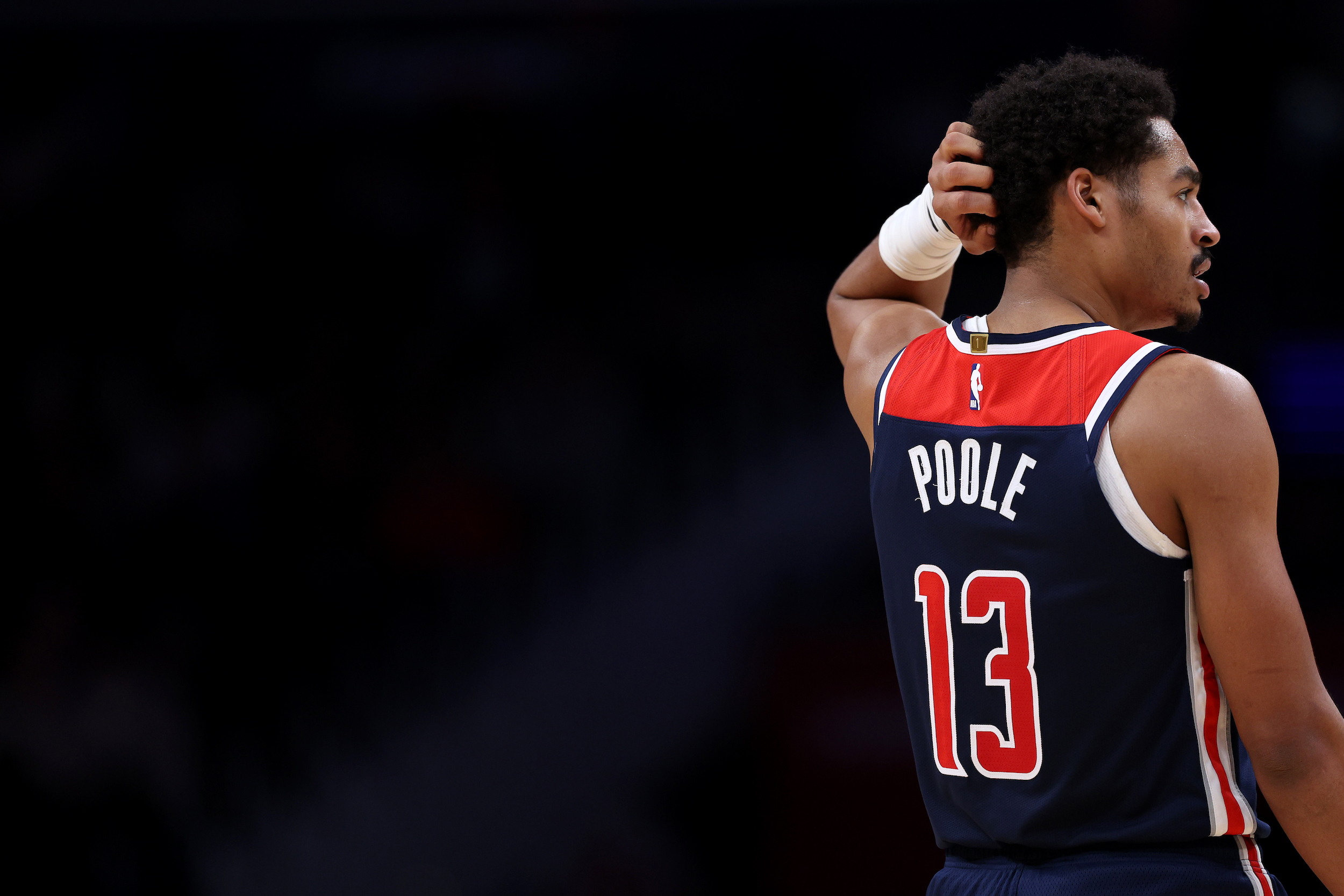 Jordan Poole scratches his head during the loss.