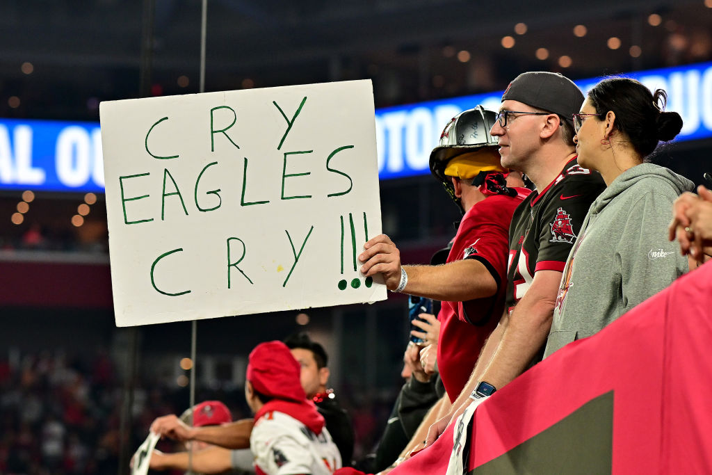 A Tampa Bay Buccaneers fan holds a sign that reads, "Cry Eagles Cry!!!" during the fourth quarter in the NFC Wild Card Playoffs between the Philadelphia Eagles and the Tampa Bay Buccaneers at Raymond James Stadium on January 15, 2024 in Tampa, Florida.