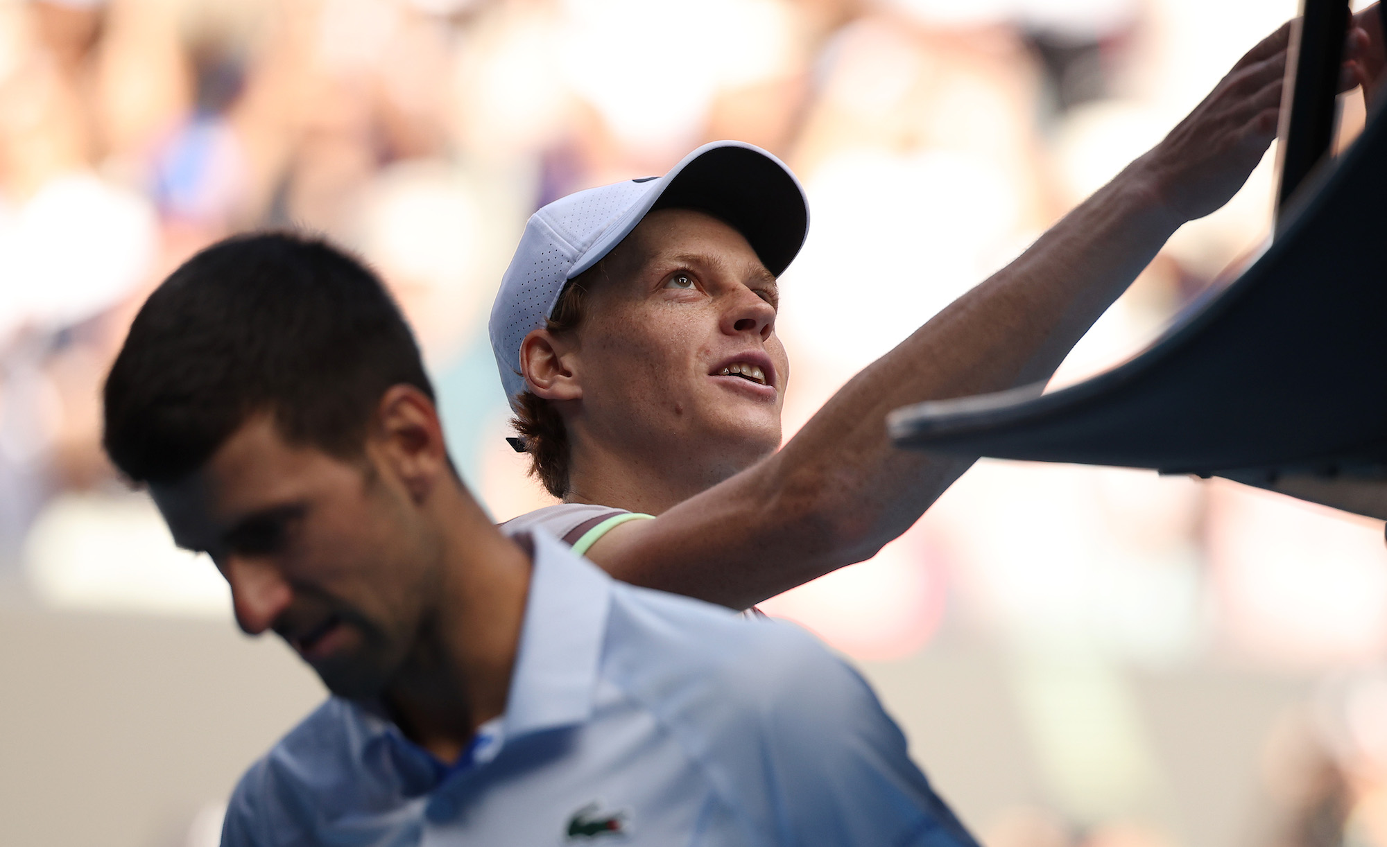 Jannik Sinner shakes hands with the umpire after beating Novak Djokovic in their Australian Open semifinal