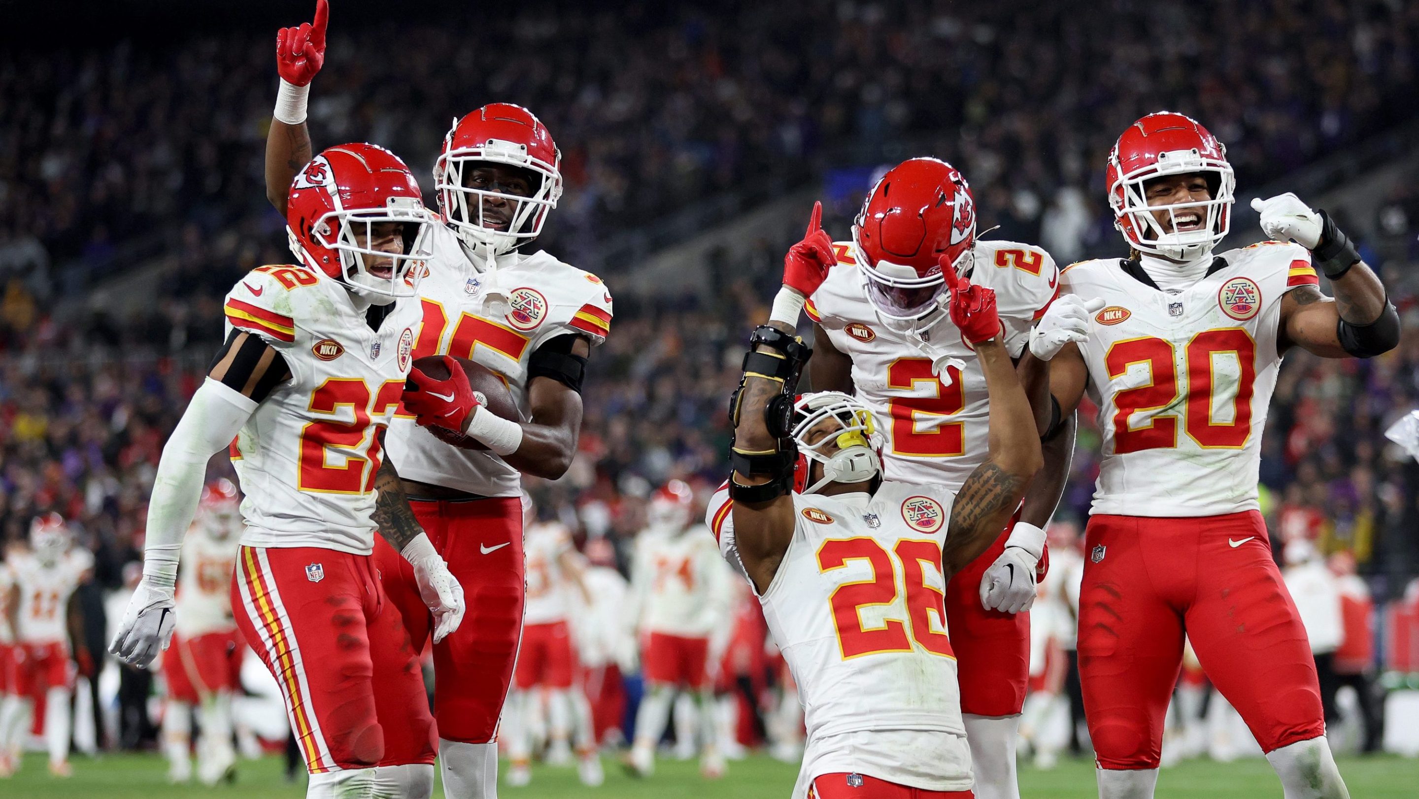 Deon Bush #26 of the Kansas City Chiefs celebrates with teammates after an interception against the Baltimore Ravens during the fourth quarter in the AFC Championship Game .