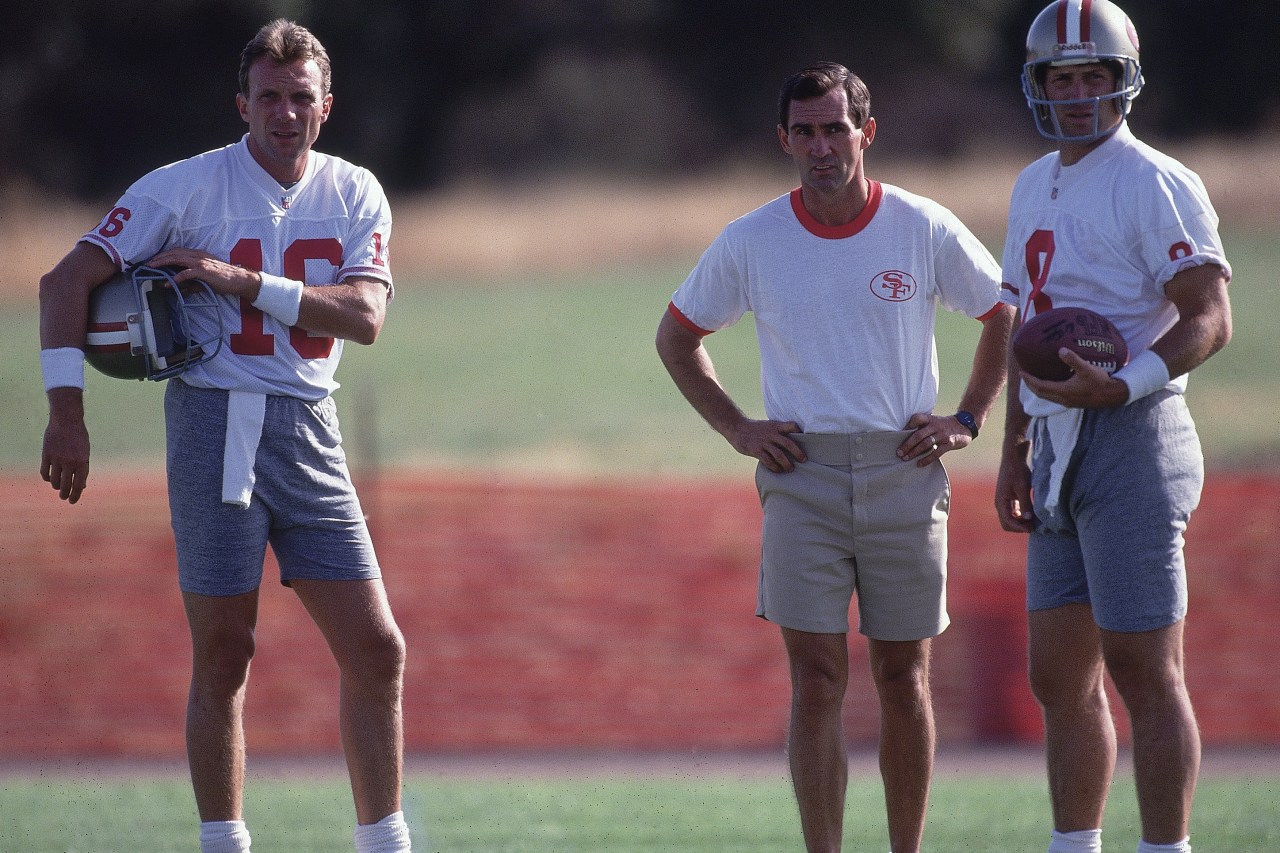Football: View of San Francisco 49ers (L-R) QB Joe Montana (12), offensive coordinator Mike Shanahan, and QB Steve Young (2) on field during training camp practice at Sierra College. Rocklin, CA 7/15/1992 CREDIT: Peter Read Miller (Photo by Peter Read Miller /Sports Illustrated via Getty Images) (Set Number: X43196 TK1 R18 F3 )