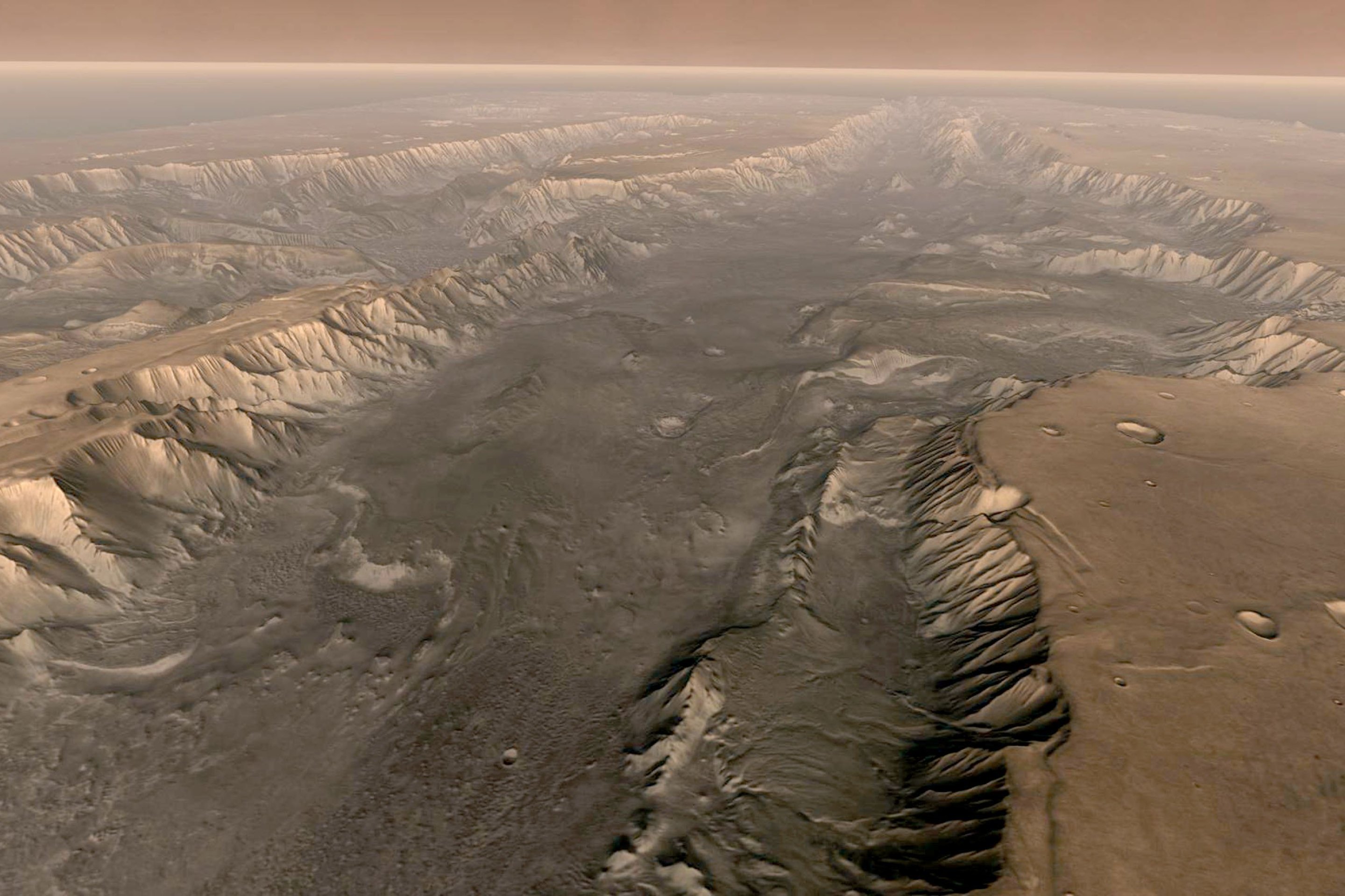 VALLES MARINERIS, MARS - Mars' own Grand Canyon, Valles Marineris, is shown on the surface of the planet in this composite image made aboard NASA's Mars Odyssey spacecraft. The image was taken from a video featuring high-resolution images from Arizona State University's Thermal Emission Imaging System multi-band camera on board the spacecraft. The mosaic was then colored to approximate how Mars would look to the human eye. Valles Marineris is 10 times longer, five times deeper and 20 times wider than Earth's Grand Canyon. (Photo by NASA/Arizona State University via Getty Images)