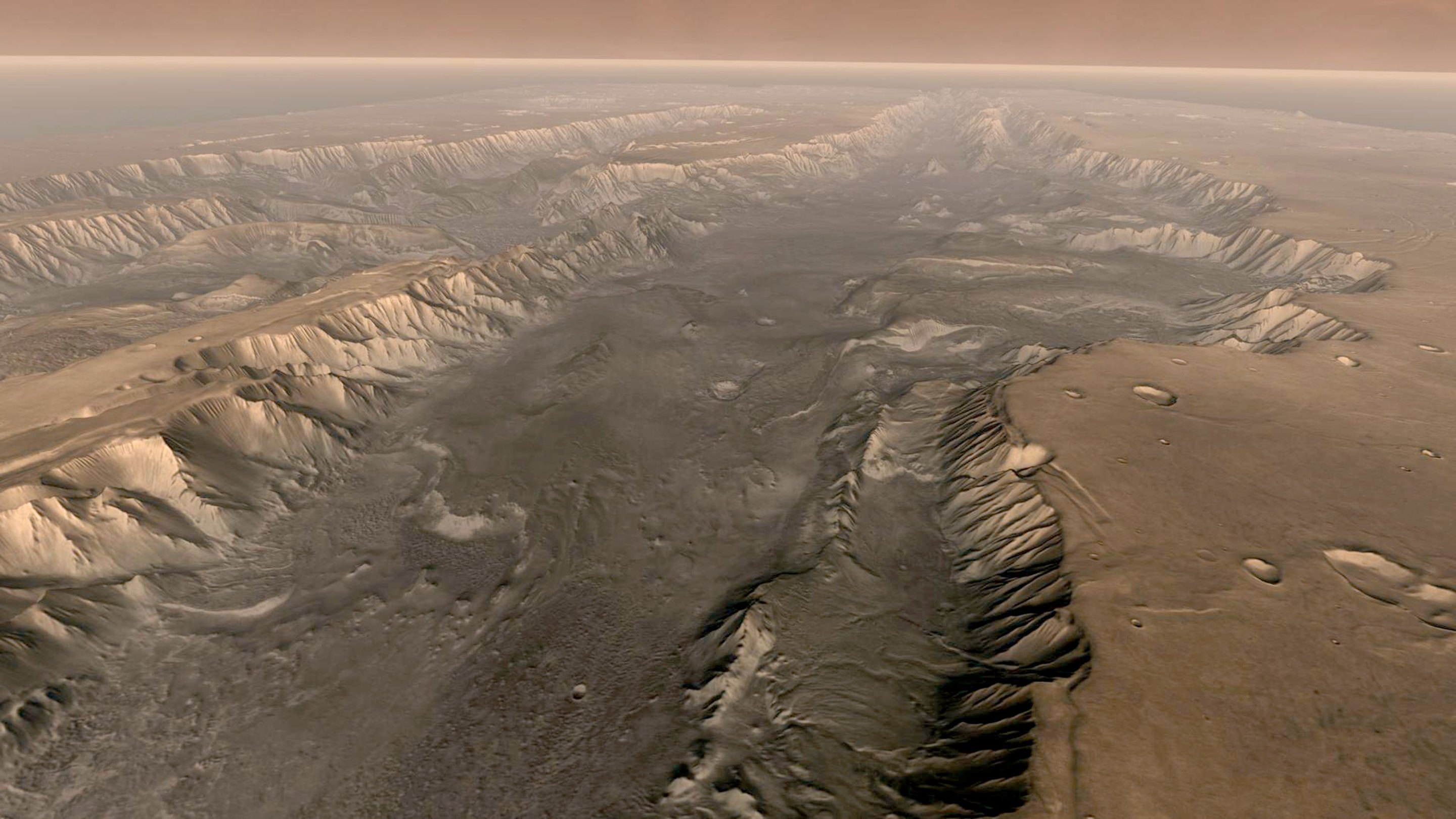 VALLES MARINERIS, MARS - Mars' own Grand Canyon, Valles Marineris, is shown on the surface of the planet in this composite image made aboard NASA's Mars Odyssey spacecraft. The image was taken from a video featuring high-resolution images from Arizona State University's Thermal Emission Imaging System multi-band camera on board the spacecraft. The mosaic was then colored to approximate how Mars would look to the human eye. Valles Marineris is 10 times longer, five times deeper and 20 times wider than Earth's Grand Canyon. (Photo by NASA/Arizona State University via Getty Images)