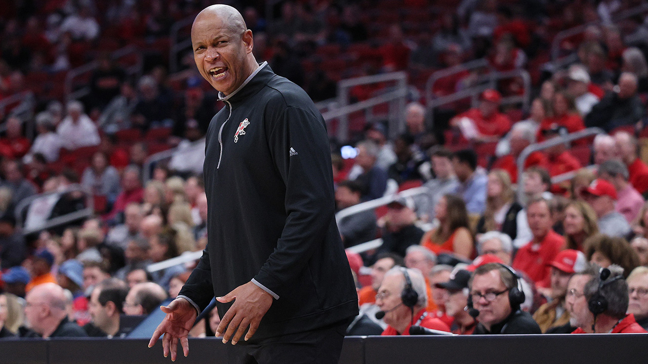LOUISVILLE, KENTUCKY - JANUARY 27: Kenny Payne the head coach of the Louisville Cardinals gives instructions to his team in the game against the Virginia Cavaliers at KFC YUM! Center on January 27, 2024 in Louisville, Kentucky.