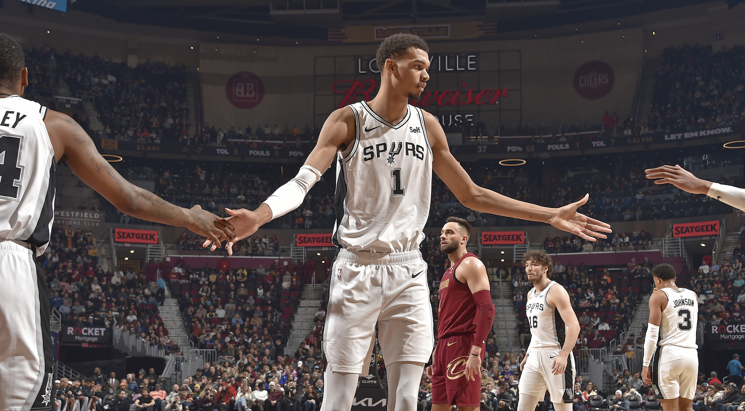 Victor Wembanyama #1 of the San Antonio Spurs high fives teammates during the game against the Cleveland Cavaliers on January 7, 2024 at Rocket Mortgage FieldHouse in Cleveland, Ohio.