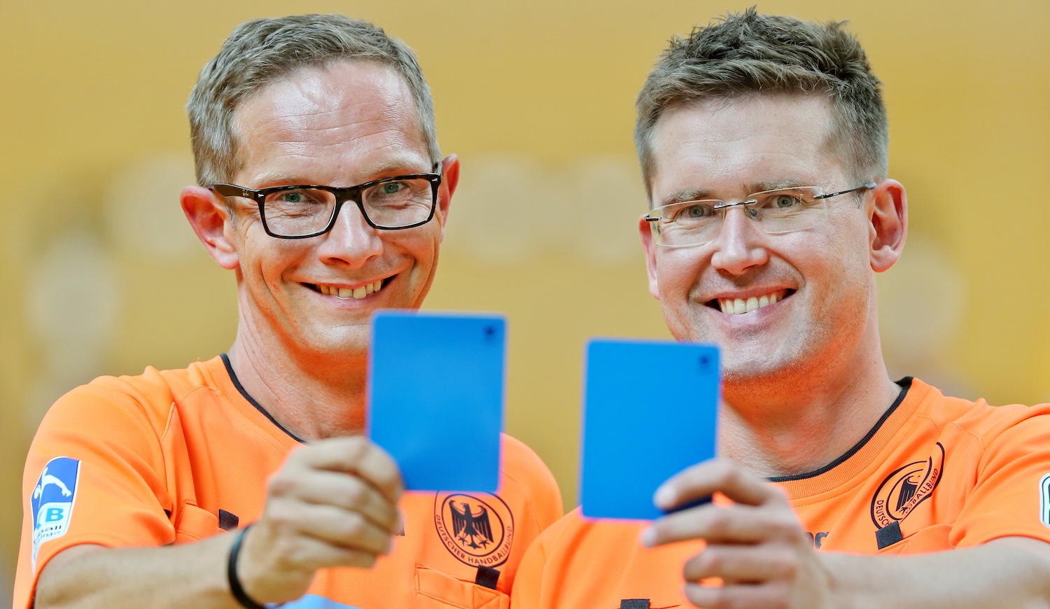 Handball referees Marcus Helbig (l) and Lars Geipel show the new blue cards in Leipzig, Germany, 1 August 2016. The two will be refereeing at the Olympic games for the second time. PHOTO: JAN WOITAS/DPA | usage worldwide (Photo by Jan Woitas/picture alliance via Getty Images)