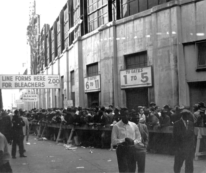 Fans lined up to purchase World Series tickets outside Ebbets Field, Brooklyn, New York, New York, October 1949.