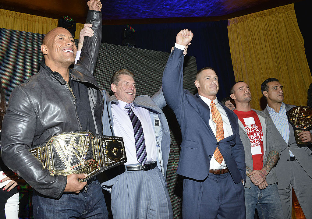 Dwayne Johnson and Vince McMahon at a press conference