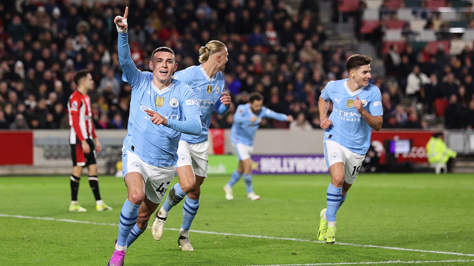 Phil Foden of Manchester City celebrates scoring his team's second goal during the Premier League match between Brentford FC and Manchester City at Brentford Community Stadium on February 05, 2024 in Brentford, England.