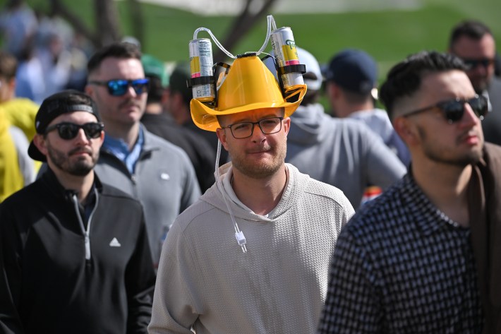 SCOTTSDALE, ARIZONA - FEBRUARY 09: Fan walks along the course during the continuation of the first round of WM Phoenix Open at TPC Scottsdale (Stadium Course) on February 9, 2024 in Scottsdale, Arizona.