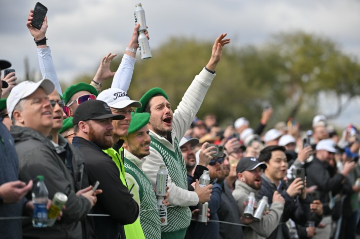 SCOTTSDALE, ARIZONA - FEBRUARY 10: Fans cheer on the 15th hole during the continuation of the second round of WM Phoenix Open at TPC Scottsdale (Stadium Course) on February 10, 2024 in Scottsdale, Arizona.