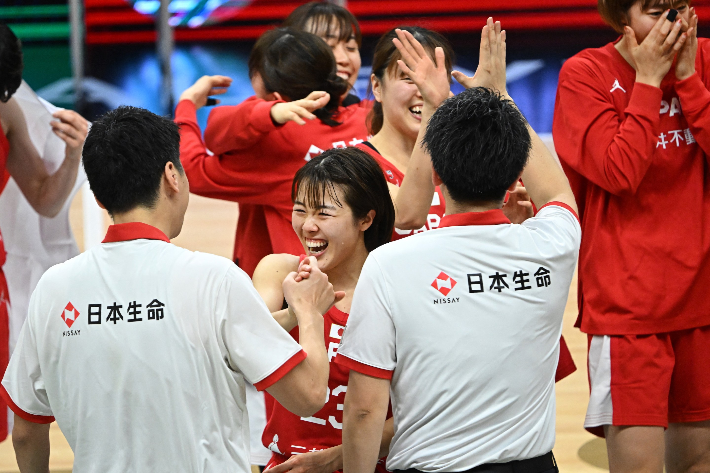 Japan's Mai Yamamoto (C) celebrates the team's victory after the 2024 FIBA Women's Olympic qualifying tournament basketball match between Canada and Japan in Sopron, Hungary on February 11, 2024.