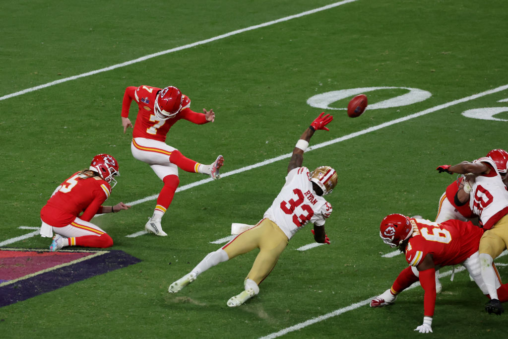 Harrison Butker #7 of the Kansas City Chiefs kicks a field goal late in the fourth quarter to tie the game against the San Francisco 49ers during Super Bowl LVIII at Allegiant Stadium on February 11, 2024 in Las Vegas, Nevada.