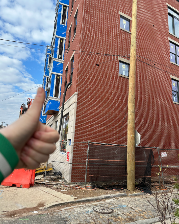 photo of a wire going through an empty brick spot in a building