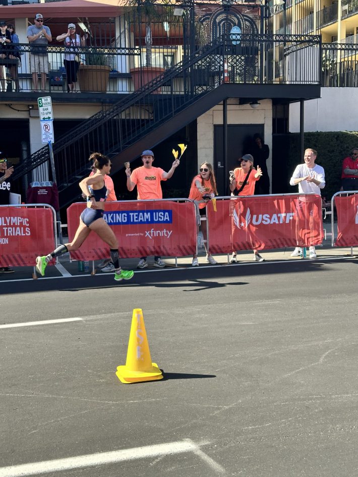 Sofie Schunk runs past supporters at the Orlando Trials.