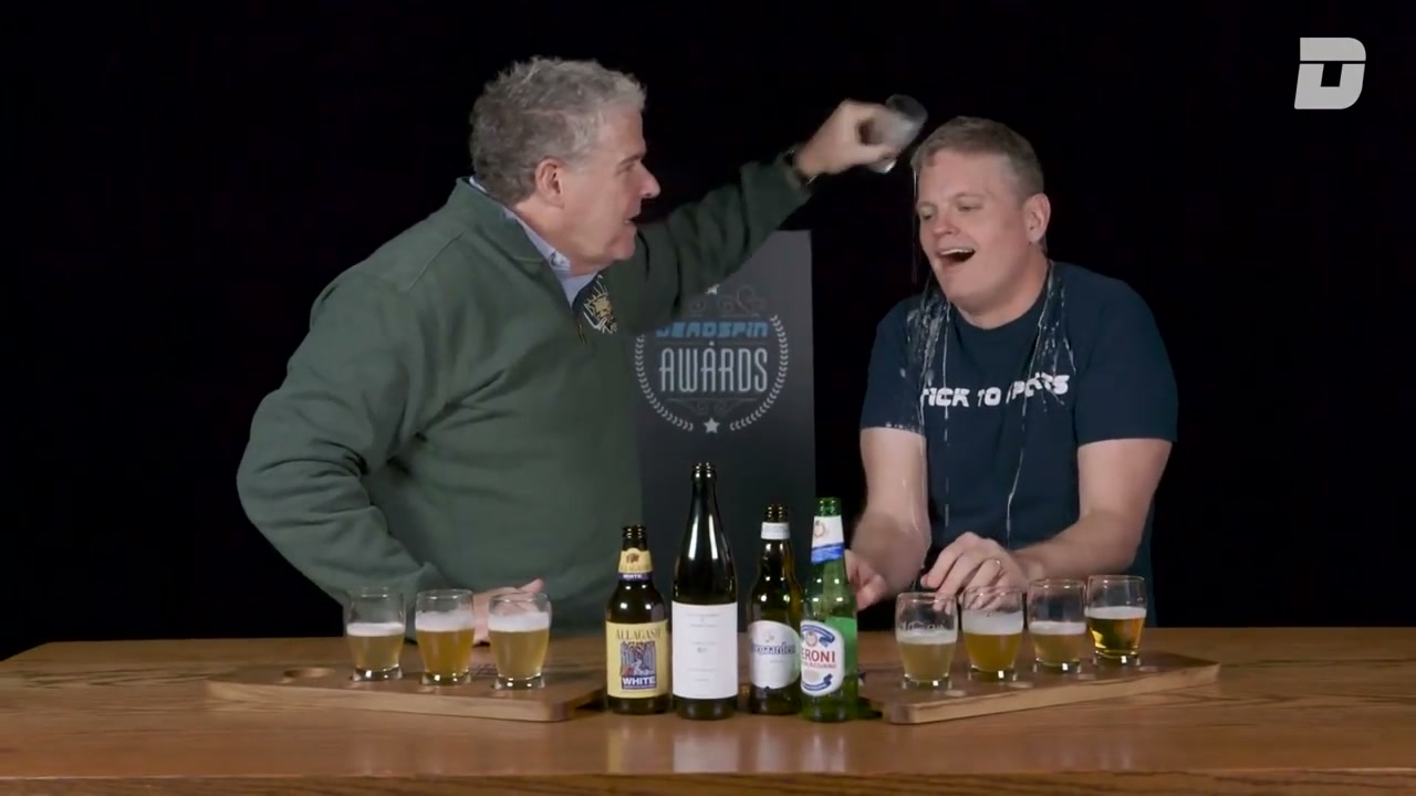 Peter King pours a beer over Drew Magary’s head, in a still from a video from the old site.
